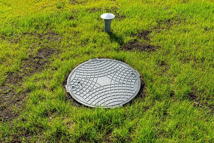 Septic tank cover installed on lawn area