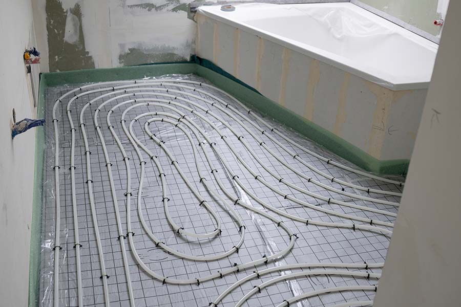 Radiant floor heating pipes installed
